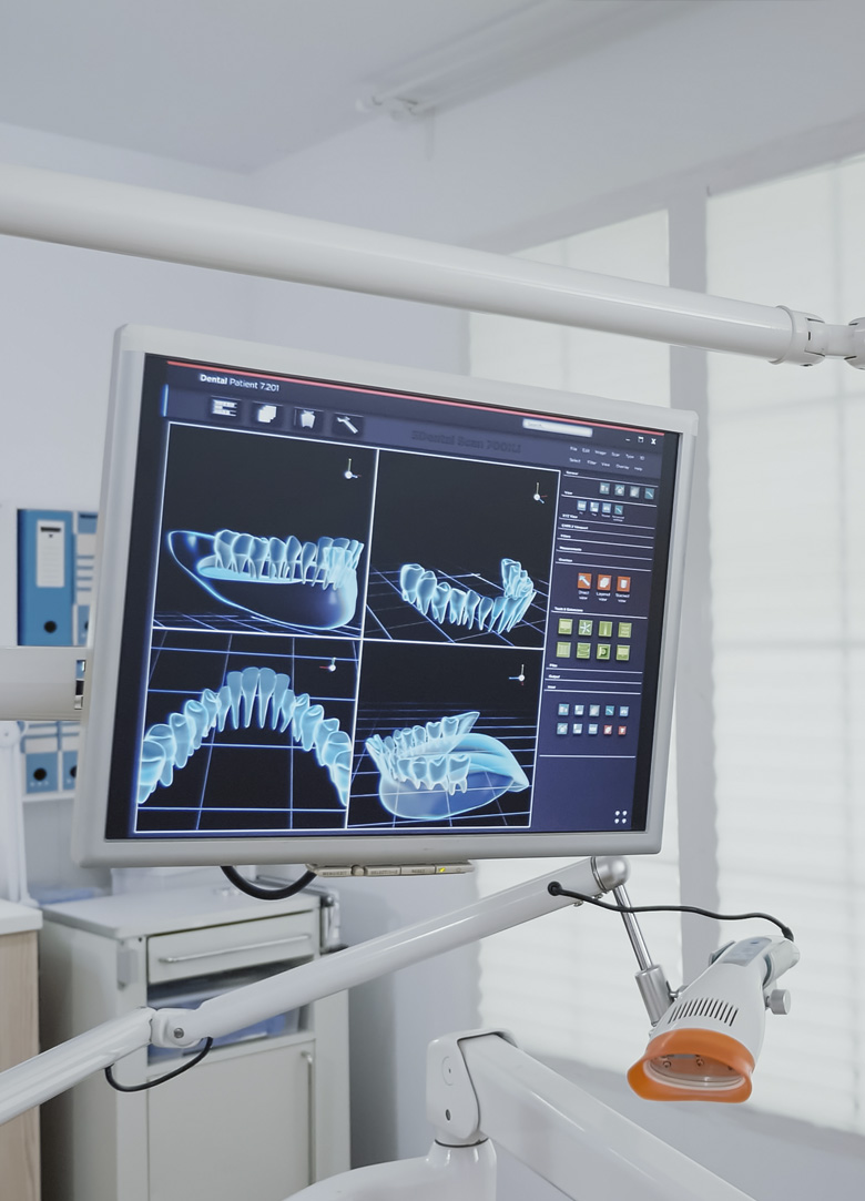 Close up of female dentist looking through dental microscope